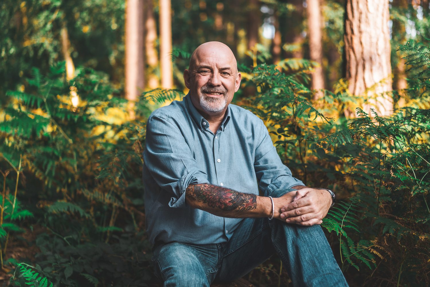 Personal brand portrait of a business owner in a Surrey woodland