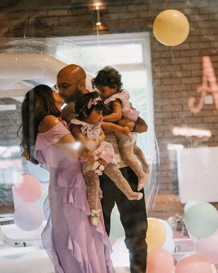 Family with balloons at a christening party