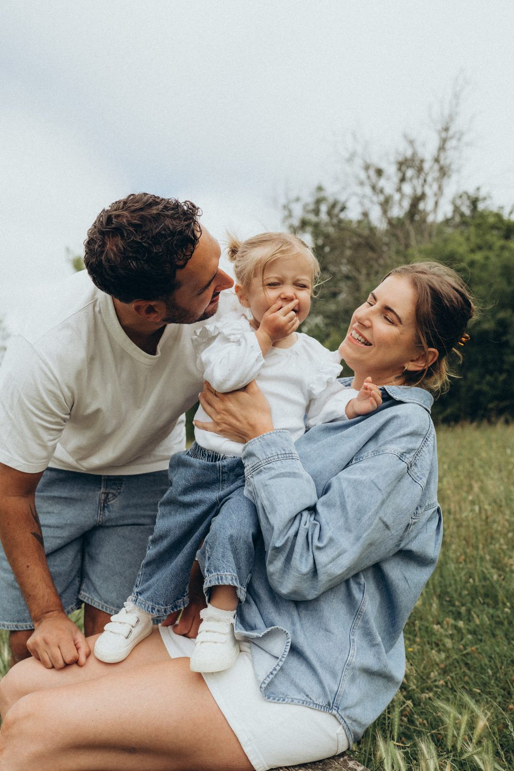Family in coordinated white and denim outfits for a photoshoot in Surrey