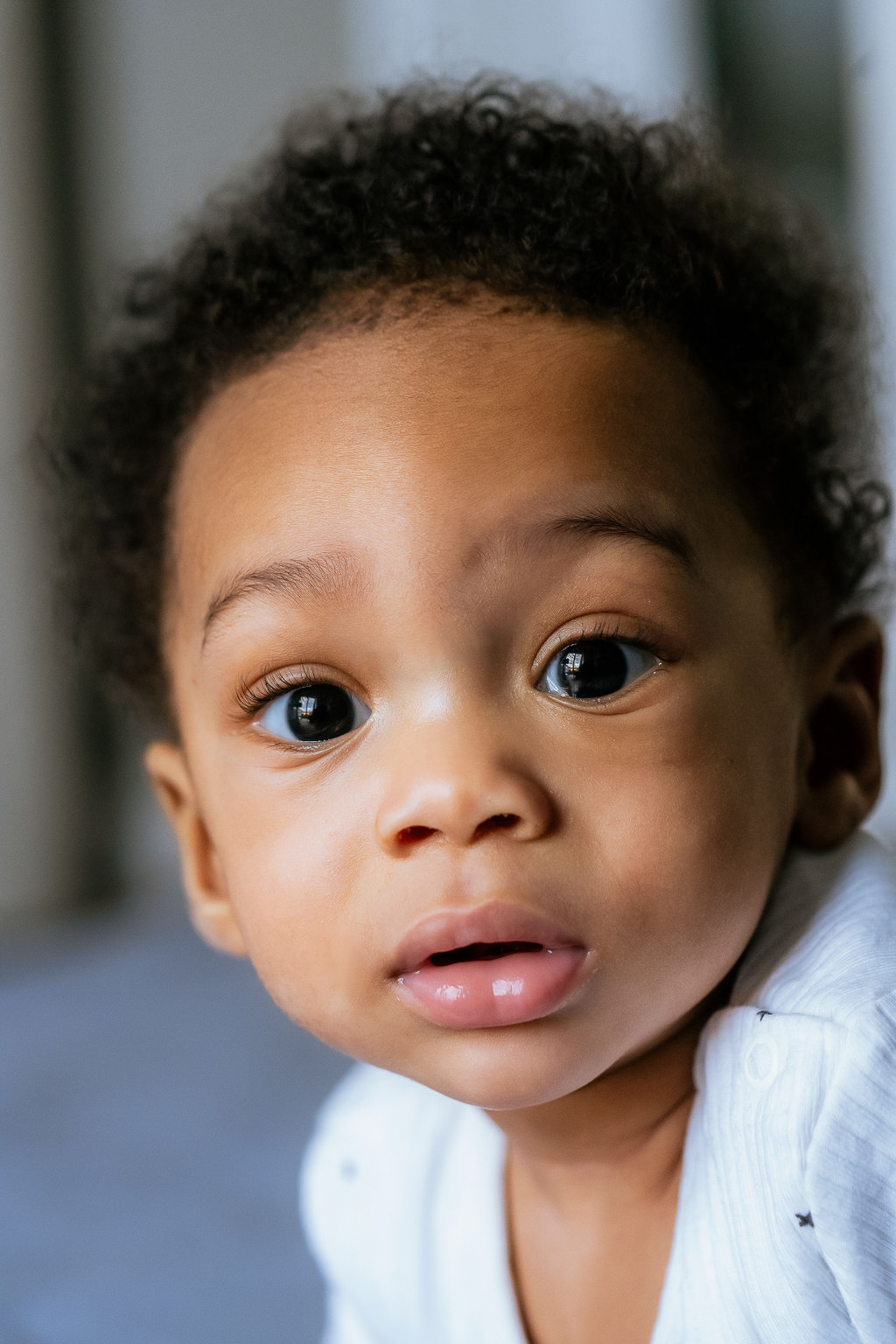 Close-up portrait of a baby during an at-home newborn session in Surrey