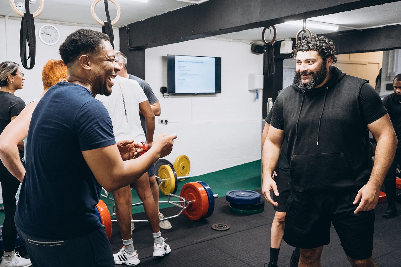 Two members laughing together in the middle of the SSP Team Games
