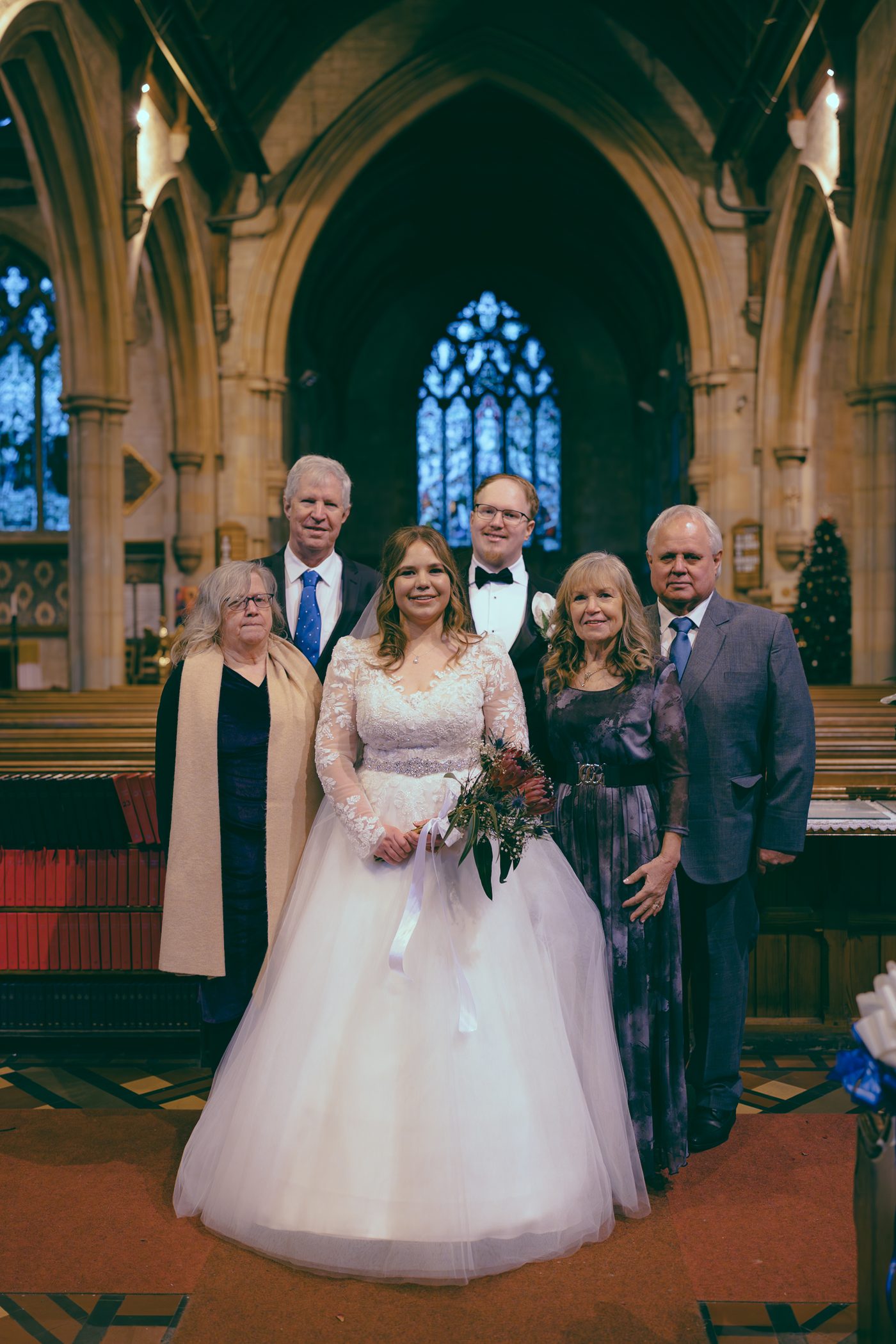 Wedding family group inside St. John the Evangelist Church, Caterham Valley