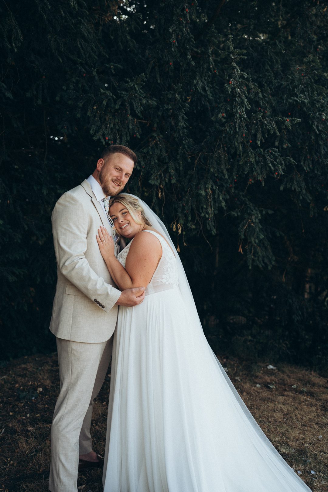 Newlyweds holding each other after the ceremony