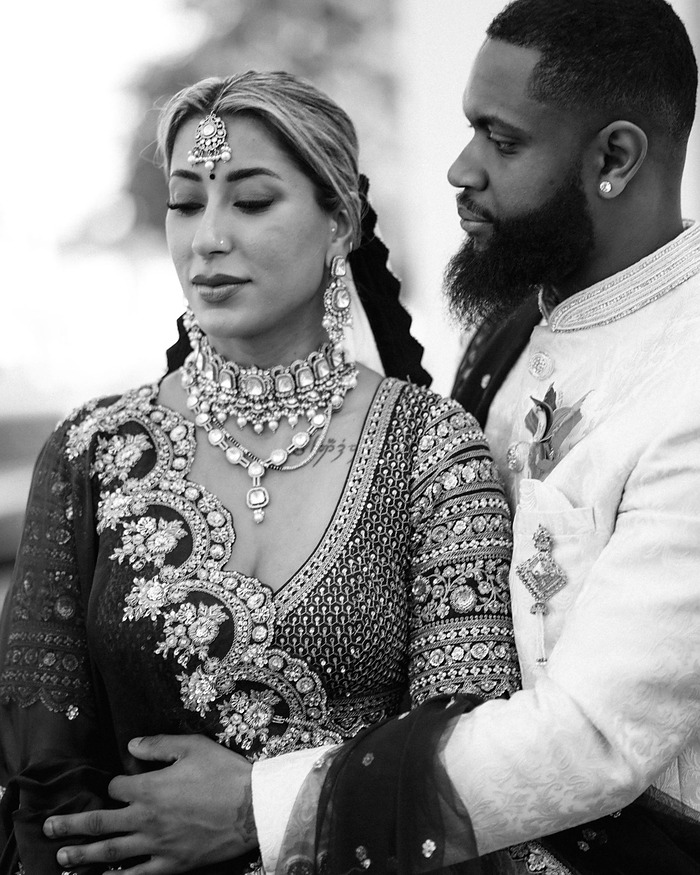 Intimate wedding portrait of a couple in elegant dress