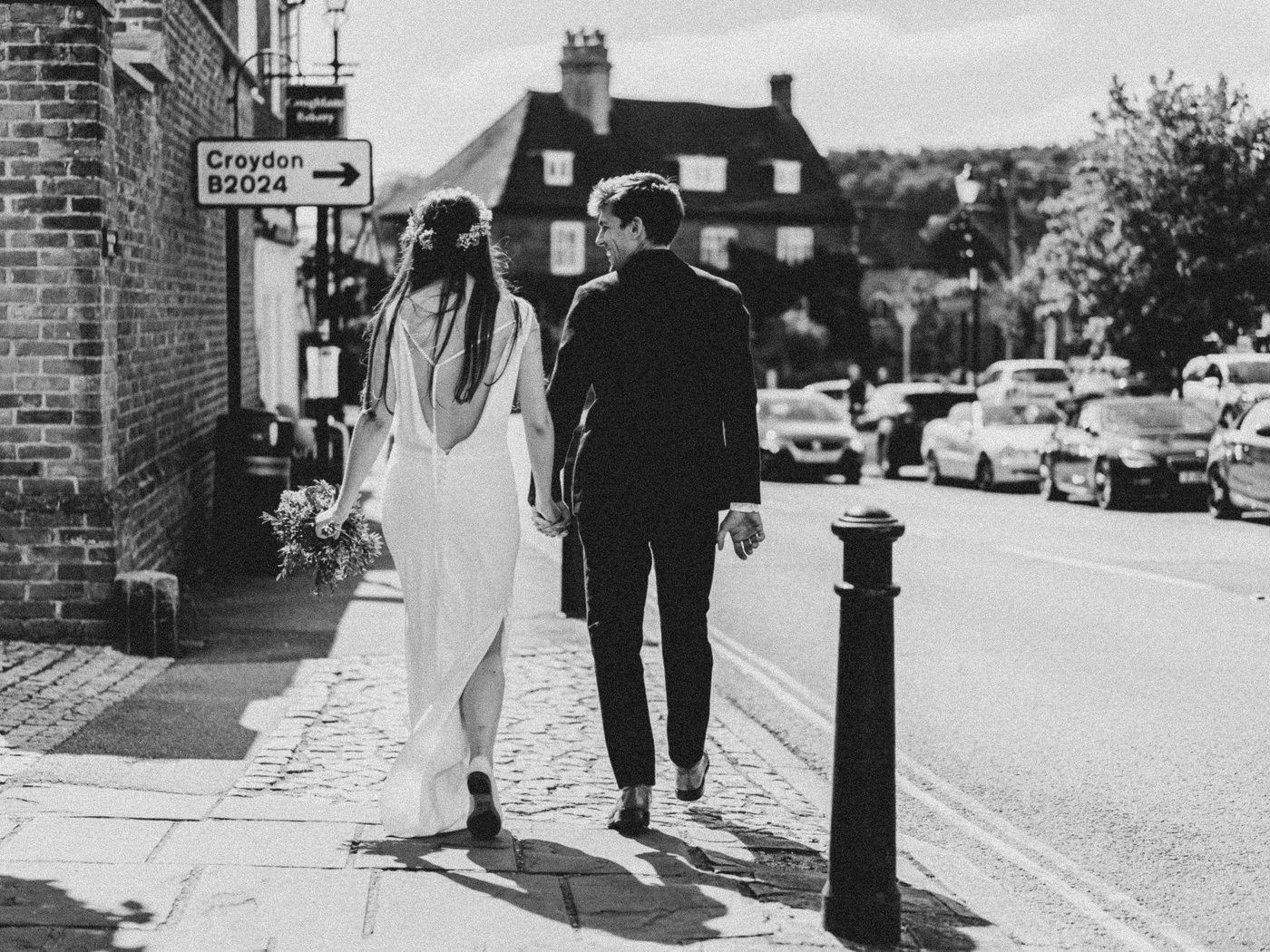 Black and white wedding portrait on a Surrey street