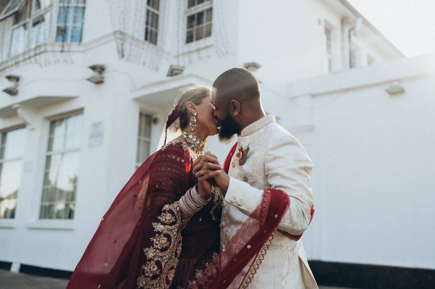 Newlyweds share a kiss at their London wedding