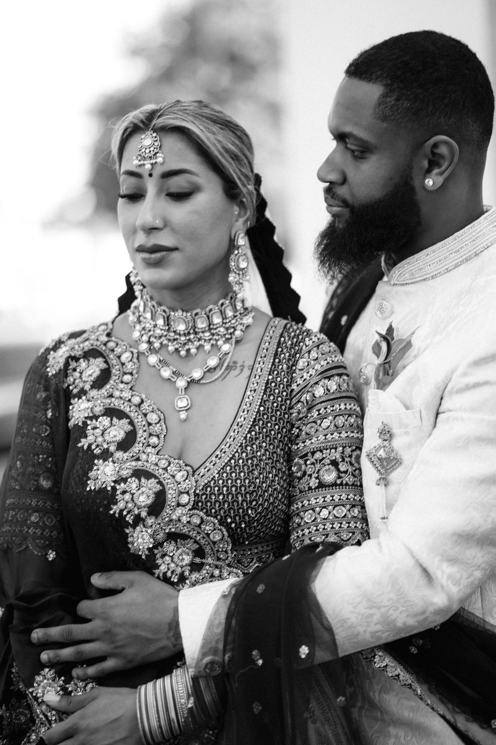Intimate wedding portrait of a couple in elegant dress